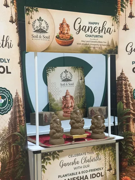 Soil & Soul booth display with plantable Ganesha idols and Ganesh Chaturthi banners
